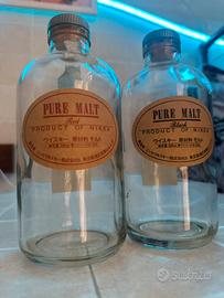 Bottiglie vuote wisky pure malt