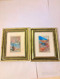 Coppia di dipinti con cornici dorate