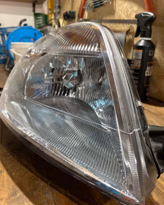 Faro ford fiesta 2004, nuovo , completo