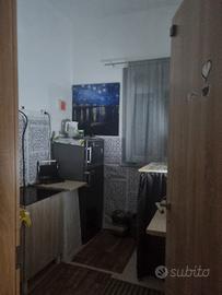 Stanza in appartamento a piano terra