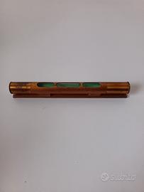 Antica livella in ottone 