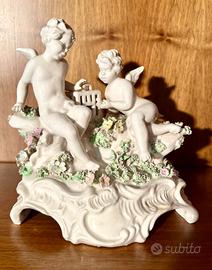 Putti con fiorellini policromi statuina Capodimone