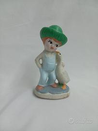 Statuetta bambino con papera