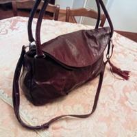 Borsa Nannini busta pochette zaino pelle bordeaux