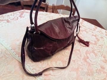 Borsa Nannini busta pochette zaino pelle bordeaux