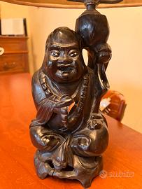 Budda in legno con lampada