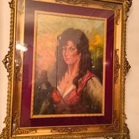 Elegante quadro con cornice dorata