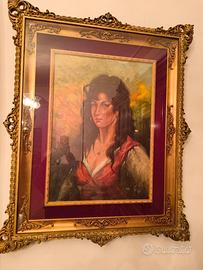 Elegante quadro con cornice dorata