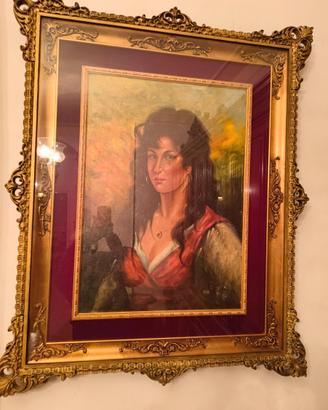 Elegante quadro con cornice dorata