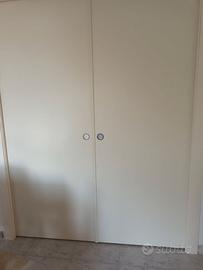 porta a due ante scorrevole a scrigno