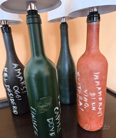 Bottiglie decorate a mano con aforismi