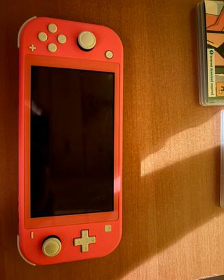 Nintendo switch lite tosa coral + 2 giochi