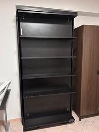 Libreria girevole con letto singolo a scomparsa