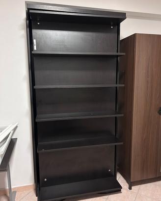 Libreria girevole con letto singolo a scomparsa