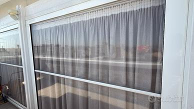 Tenda Cristal trasparente con guide per verande