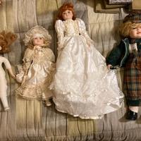 4 bambole in porcellana d'epoca