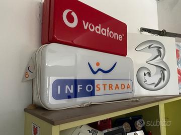 Insegne luminose telefonia anni 2000