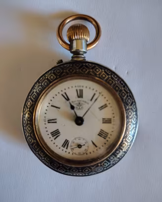 Orologio da tasca F.Bachschmid cesellato a niello.