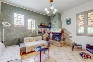 PORZIONE DI BIFAMILIARE CON GIARDINO PRIVATO