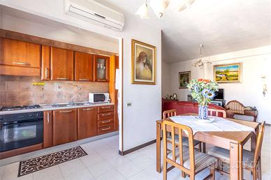 Trilocale con terrazza sovrastante e posto auto