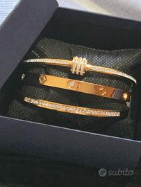 Set di Bracciali in acciaio placcato oro e zi