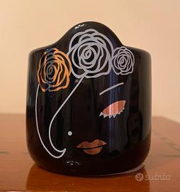 Candela con viso di donna